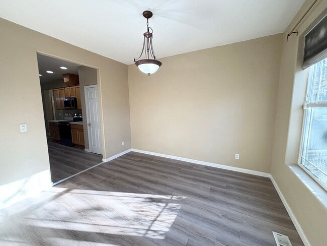 Building Photo - Stunning Remodeled Home with Office, A/C, Fenced Yard & Flexible Living Space!