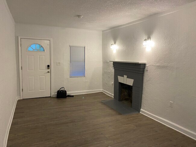 Living Room and Front Door: view from Kitchen - 735 27th Ave W