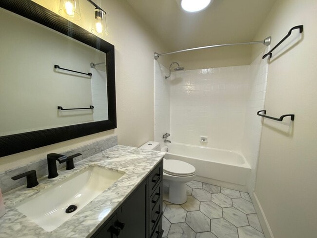Building Photo - TWO PARKING SPACES INCLUDED! In Unit Washer & Dryer! Large Private Patio for Bikes, Boards and Bb...