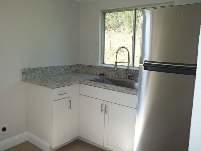 Building Photo - Rescue 4/3 retreat - includes separate cottage/office, 2 garage bays, RV pad and 5 acres with Sie...