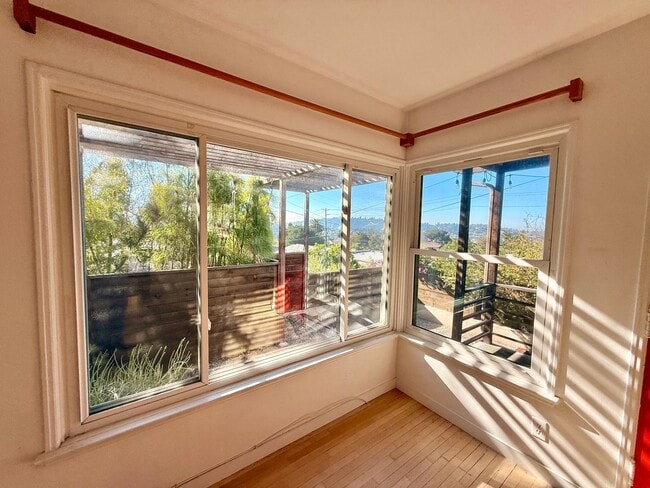 Building Photo - Hilltop Highland Park Sanctuary with Views, Private Gated Yard, In Unit Laundry, Parking & Abunda...