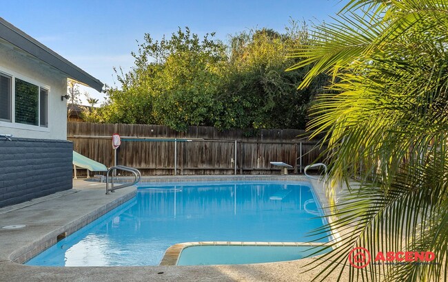 Building Photo - Beautiful 3 Bed, 2 Bath Home with Pool, Solar & Cozy Fireplace