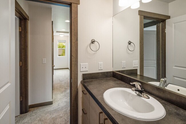 Building Photo - Pet Friendly! Gorgeous 3 Bedroom condo with double stall attached garages with AC.