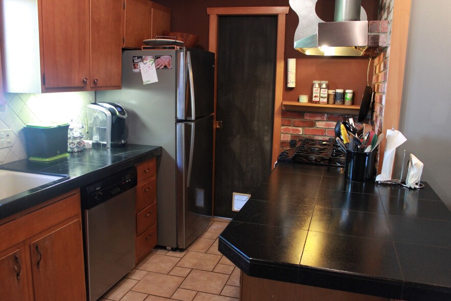 Kitchen has update appliances and gas range/stove - 1236 Northeast 103rd Street