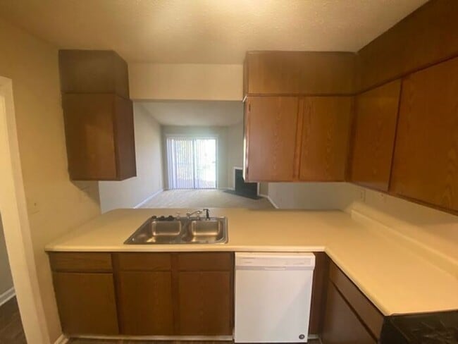 Building Photo - NOW AVAILABLE! Charming 2-Bedroom, 2-Bathroom Single-Level Townhome