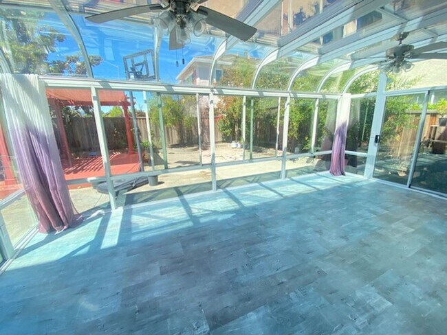 Building Photo - Spacious 5-Bedroom Home with Solar, Stunning Sunroom & Upgraded Bathrooms!