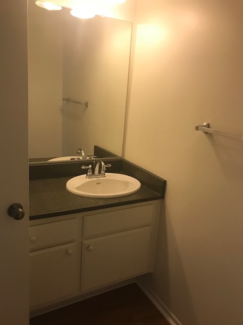 1st bathroom vanoty (white quartz counters being installed) - 6716 Clybourn Ave