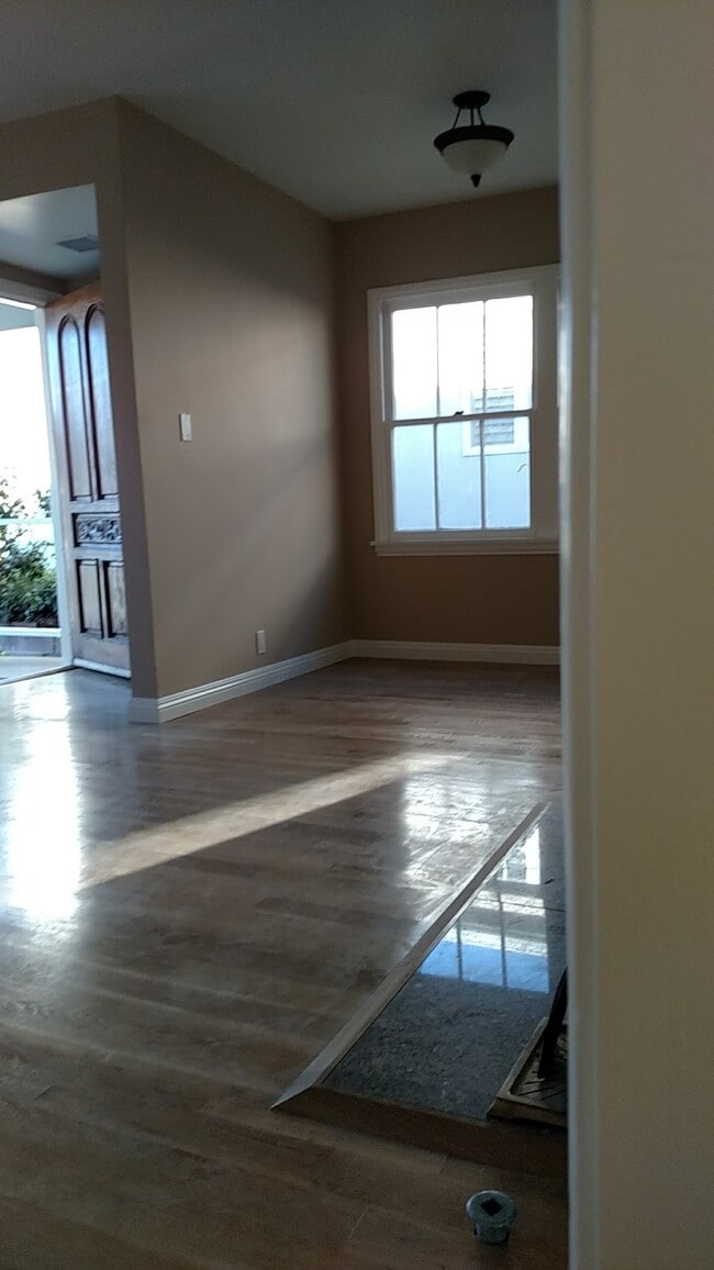 Living room, dining area, fireplace - 5835 Tellefson Rd
