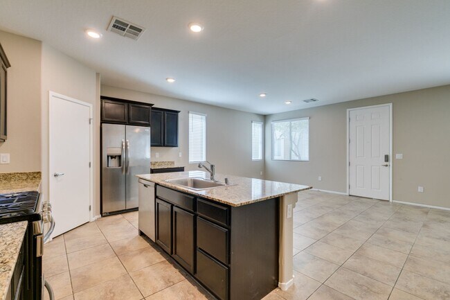 Building Photo - Spacious Townhouse with Loft & Rare 3-Car Garage!