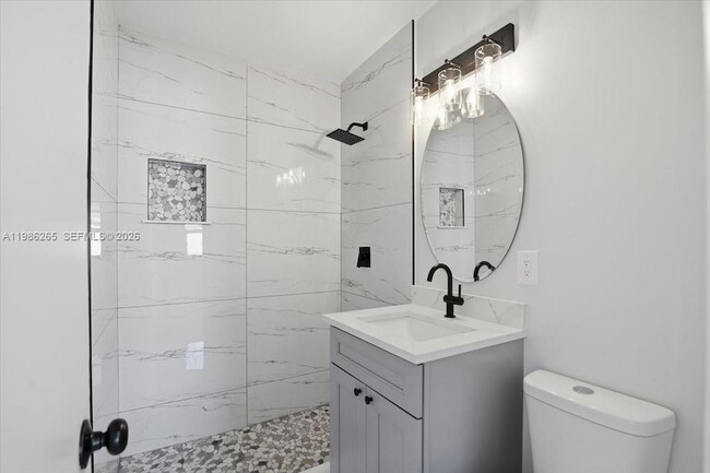 Building Photo - 1400 NE 43rd Ct