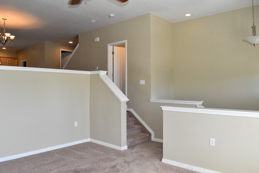 Family Room gas log fireplace with half wall open to dining room and kitchen - 684 Mason St