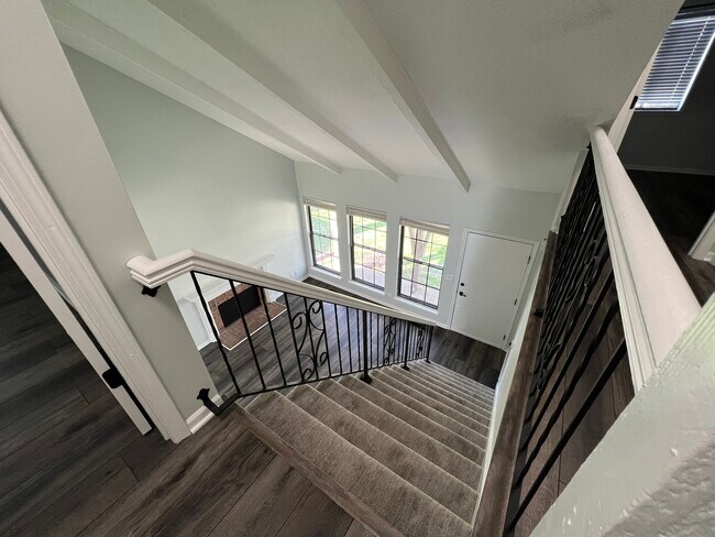 View of living room from top of stairs - 14103 W 88th Terrace