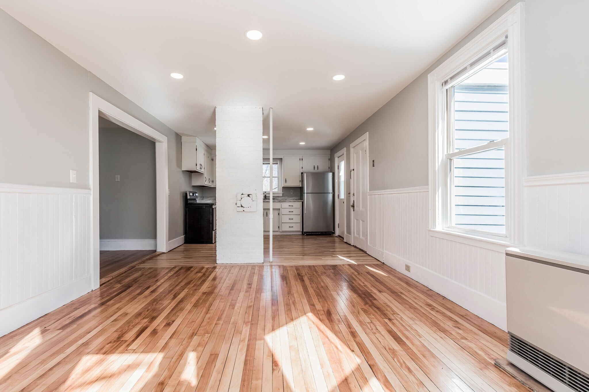 Living area - open floor plan to kitchen - 221 Bridge St