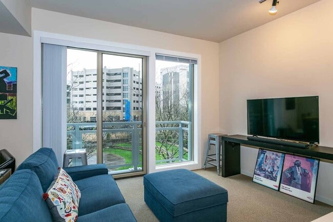 Building Photo - Gorgeous loft-style 2 floor condo with secured parking, A/C and rent includes most utilities!