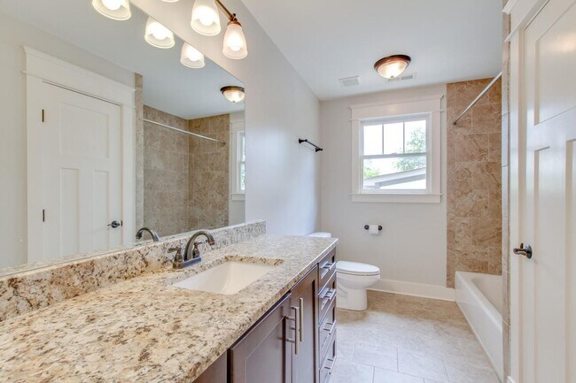 Building Photo - Stunning 4 Bedroom / Amazing Location / Fenced in Backyard / Beautiful Covered Front Porch