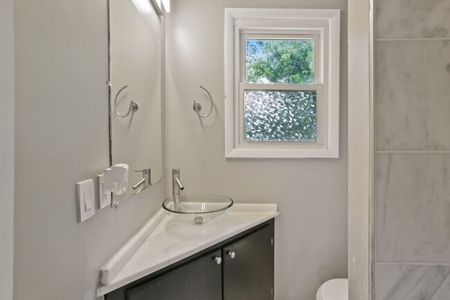 Building Photo - Move-In Ready Cape Cod with 3 Finished Levels & Huge Backyard