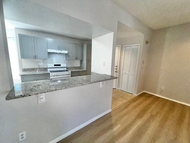 Building Photo - NEW-Remodeled bathroom & kitchen! NEW VINYL PLANK flooring & fresh paint! 2 bedroom 1 bath condo ...