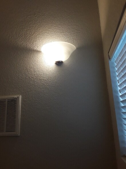 Beautiful lighting in the entry/staircase - 5074 W Claxton Circle