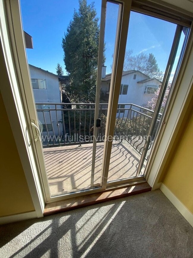 Building Photo - Spacious townhome with private backyard, garage parking, multiple decks, and a dedicated home off...