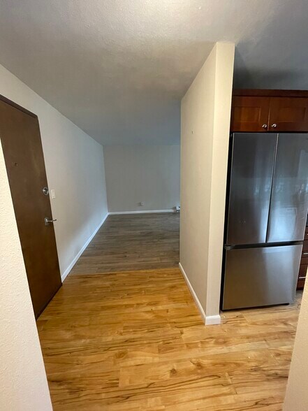 Front Entry (looking south). Front door is to left. Living Area beyond. Kitchen is to right. - 7001 Sand Point Way NE