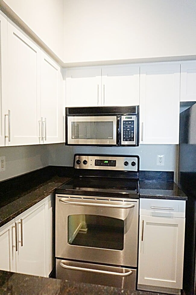 Building Photo - A Modern Living of Top-Level Unit in the C...