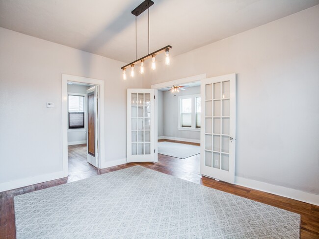 Dining Room showing French Doors leading to Living Room and Bedroom #1. - 1007 W Craig Pl