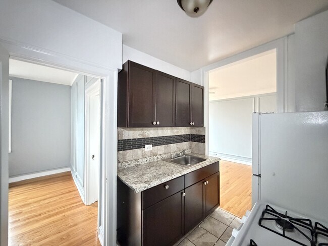 Building Photo - 1371 W Estes Ave