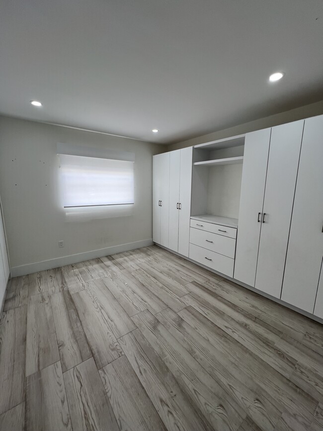 Bedroom 2 with custom closet work area - 4600 SW 67th Ave