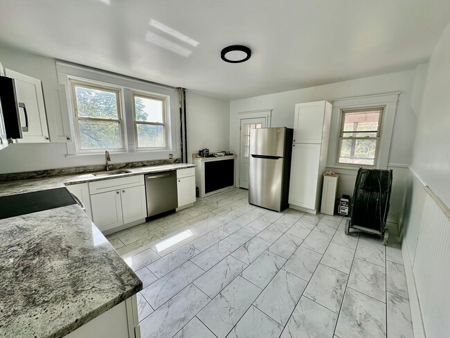 Building Photo - Large end of row 3 bedroom home located in...
