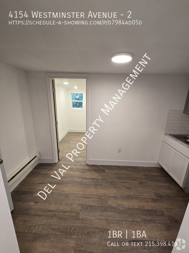 Building Photo - This updated 2nd Floor Apartment in the Mi...