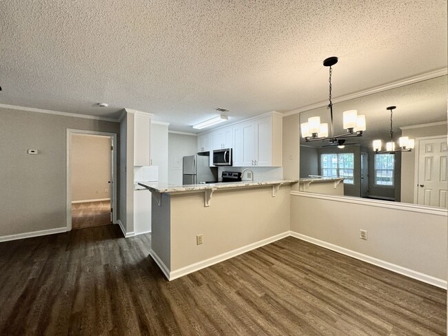 Building Photo - Updated 1st Floor/1-Level Condo Available NOW & Rent Includes Water, Sewer, Trash, Landscaping, F...