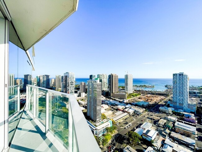 Building Photo - Furnished Symphony Condo with Direct Ocean Views and Two Parking