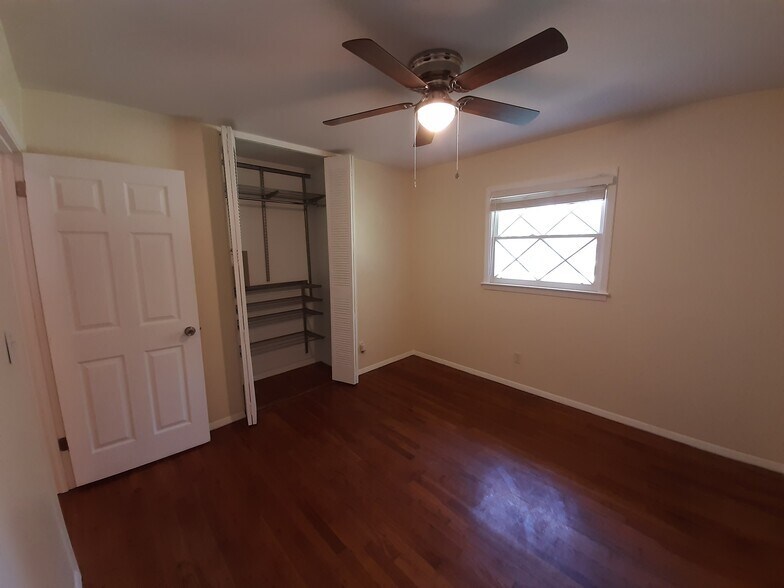 Every bedroom has adjustable Elfa closet systems and matching ceiling fans. - 2955 Fantasy Ln