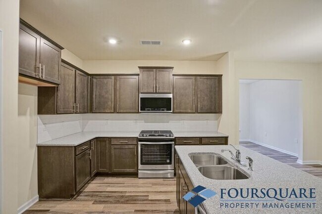 Building Photo - Spacious 3-Bed End- Unit Townhome with Mod...