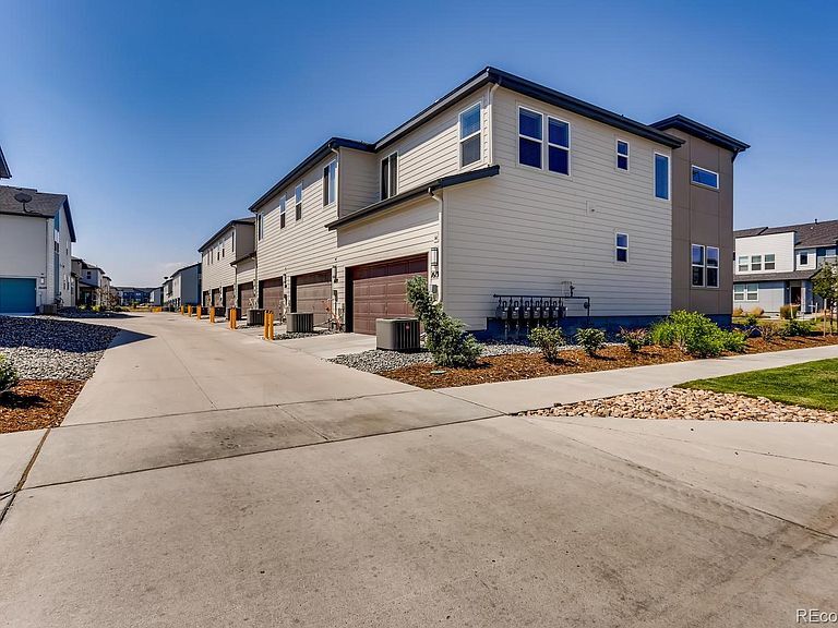 Attached 2-car garage. - 16154 E 47th Dr
