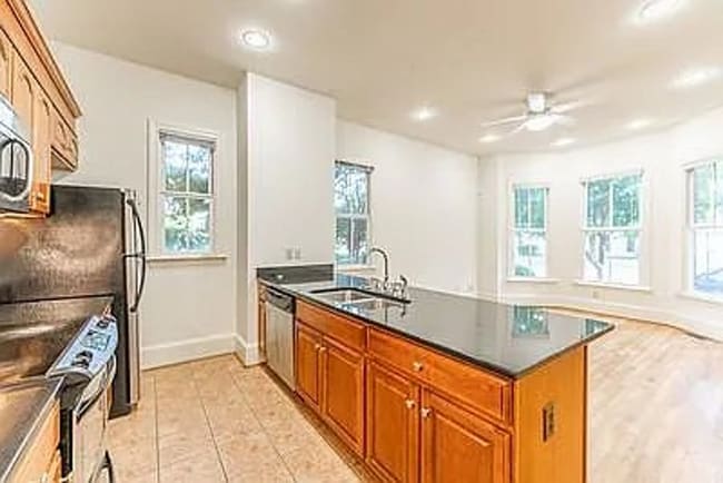 Building Photo - Escape to the perfect blend of comfort and convenience in the Fan!