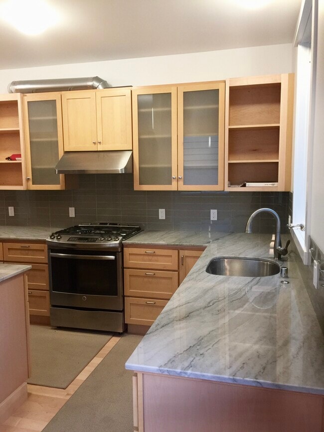 Generous kitchen for avid cooks. Lots of storage/cabinet space! Granite countertops, maple cabinets - 3918 Webster St