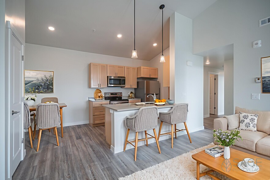 Sage Point Village Apartments - Staged Photo of Living Room, Dining Room and Kitchen - Sage Point Village