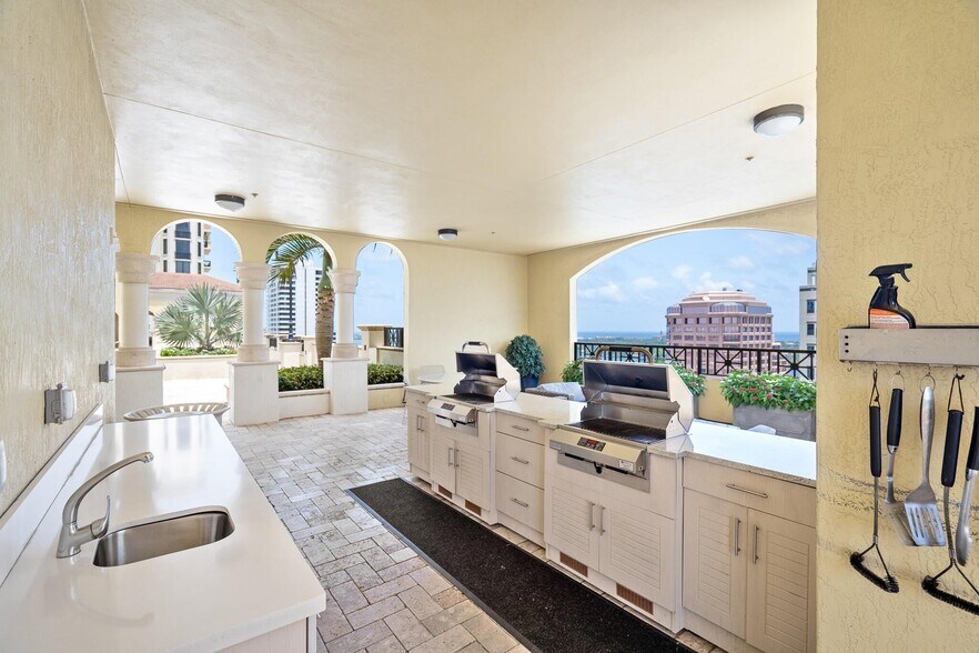 Grilling by pool - 801 S Olive Ave