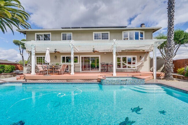 Building Photo - Remodeled 5 Bedroom Home with Heated Pool, Hillside Views, Solar, and Sunrise and Sunset Views in...