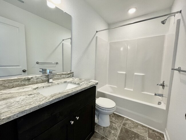 Building Photo - Practically New & Available NOW! Americana Luxury Townhomes! Pet Friendly! Attached Garage! All A...