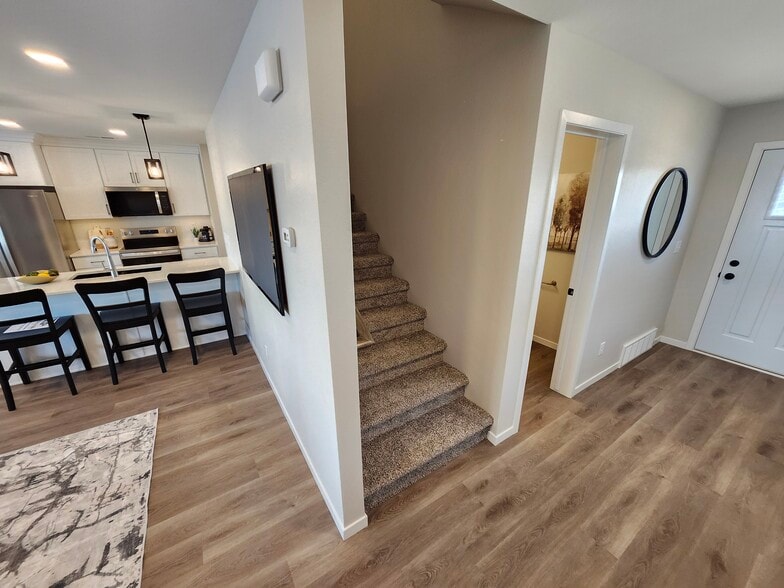 Stairs off the main entrance hallway leading to the upstairs - 5316 Welder Ave