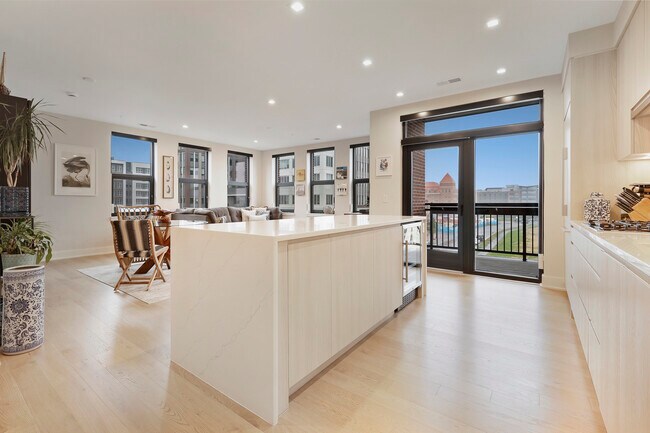 Open concept kitchen and living area - 701 Swann Ave