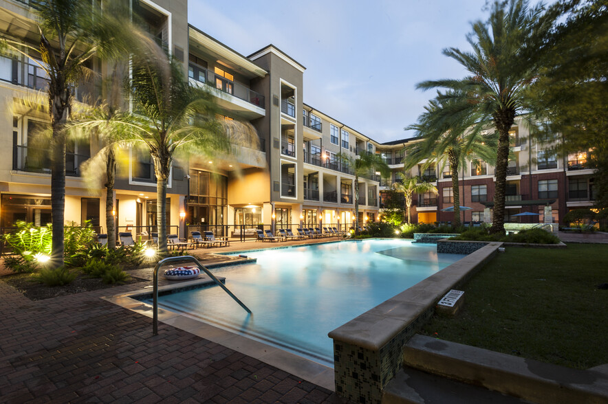 Resort-Inspired Pool with Sun Ledge, Lap Pool, and Waterfall. - The Atlantic Memorial