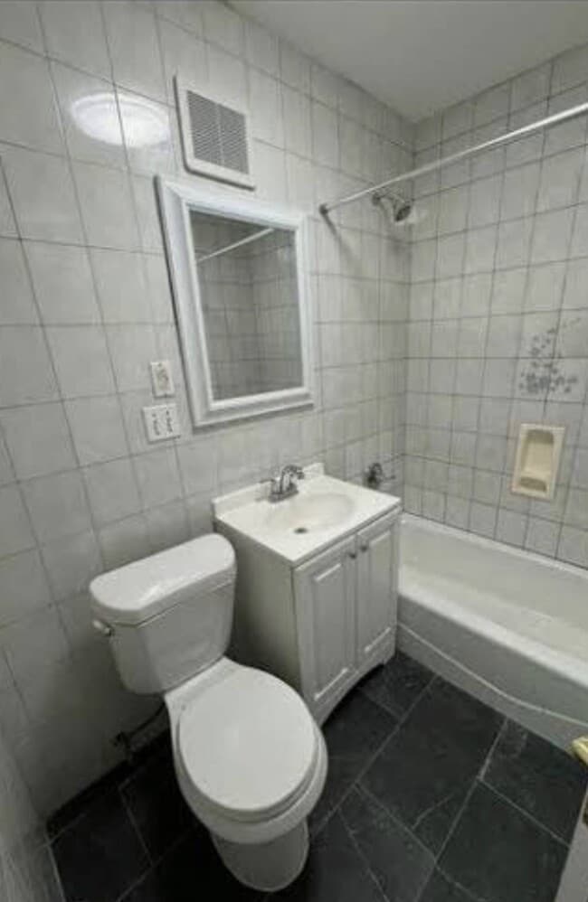 Building Photo - 69-32-36 54th Ave