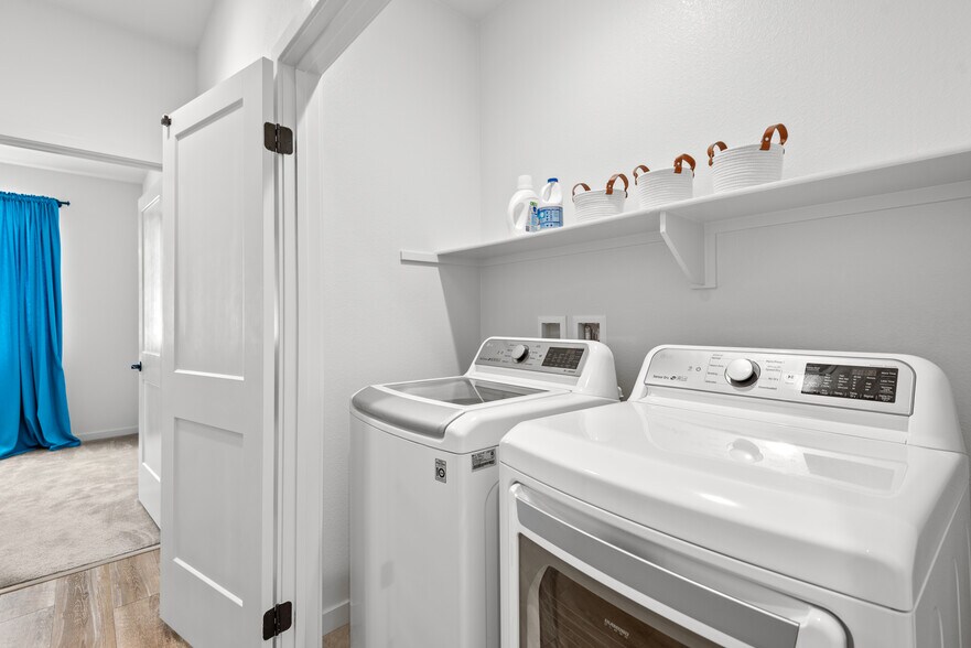 Upstairs laundry room - 212 Red Brick Dr