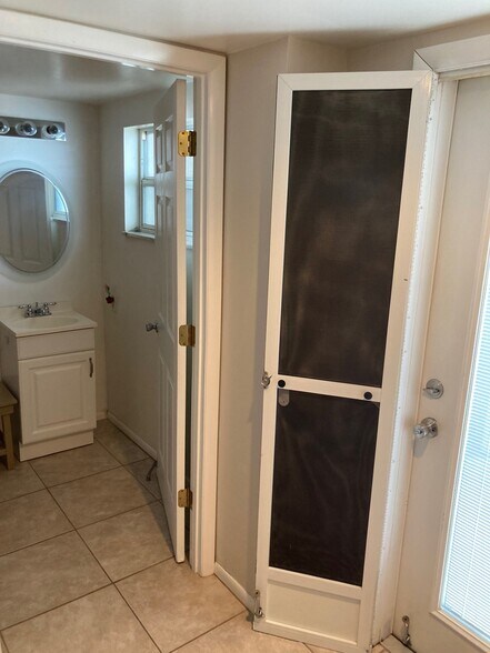 front door next to visitors bathroom - 2131 NW Lakeview Dr