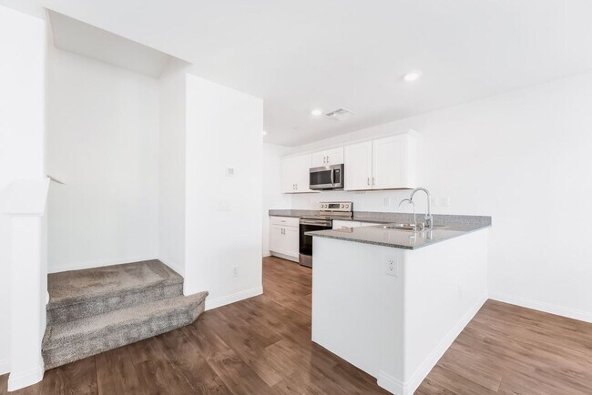 Building Photo - Modern Mosaic Townhome with Stylish Finishes & Resort-Style Community Amenities!