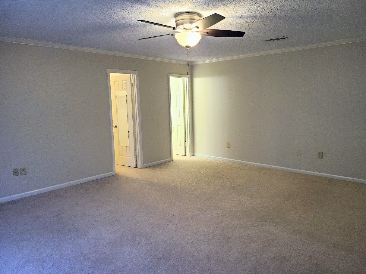 Master bedroom includes walk-in closet and en-suite bath - 12439 Coursey Blvd