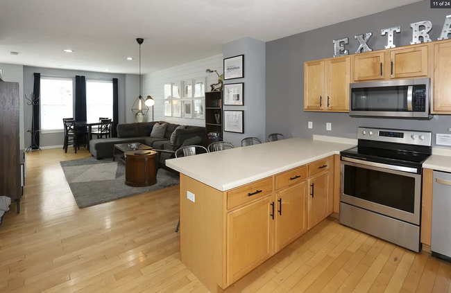 Residents can use the eat-in kitchen or use the living room space for a dinette - 584 N 8th W